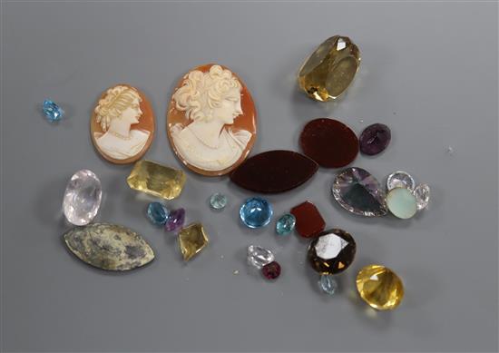 A group of assorted unmounted cut gemstones including small diamonds.